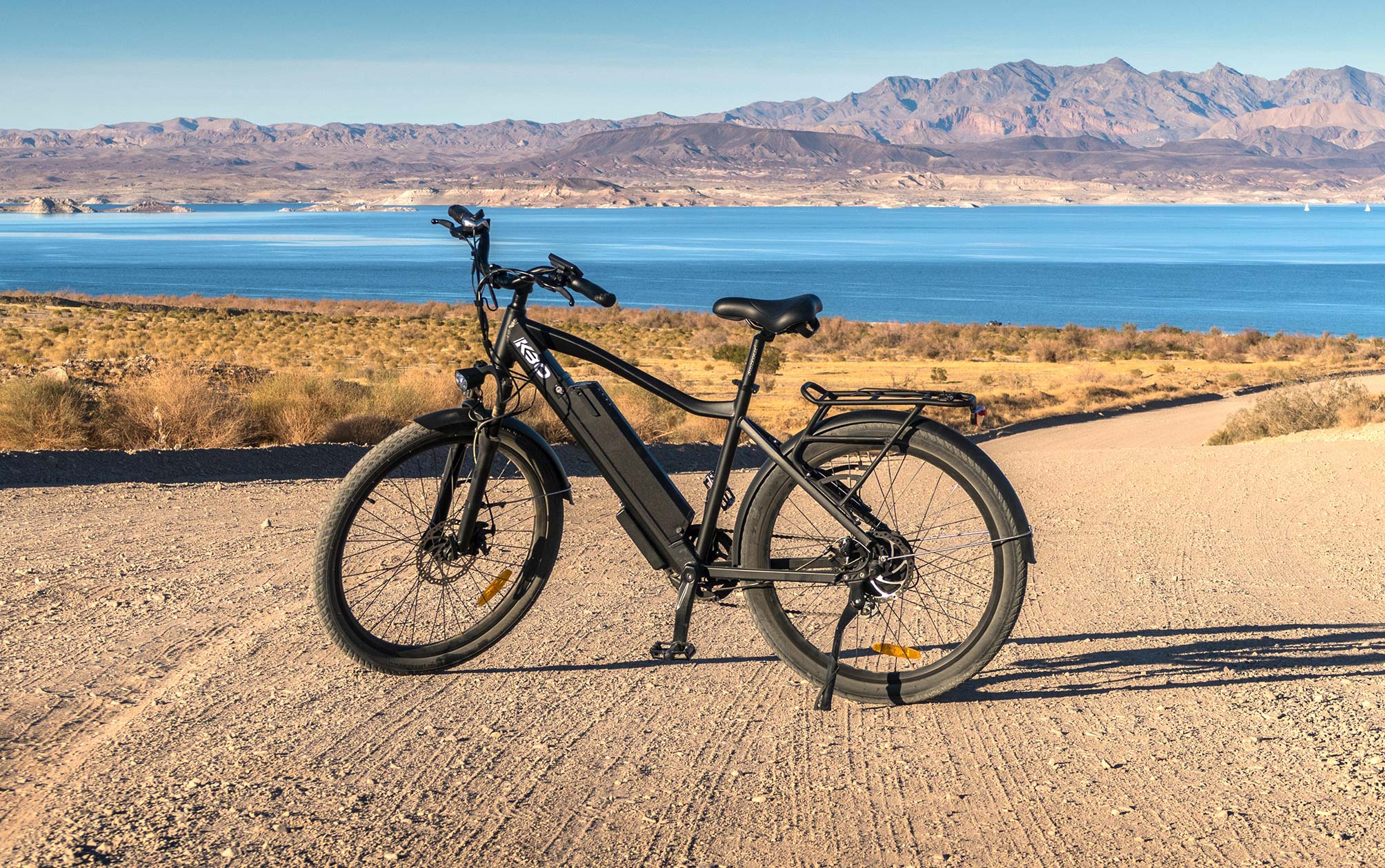 Electric Bike Standing on Dirt Road Close to Lake Electric Bike Standing on Dirt Road Close to Lake
